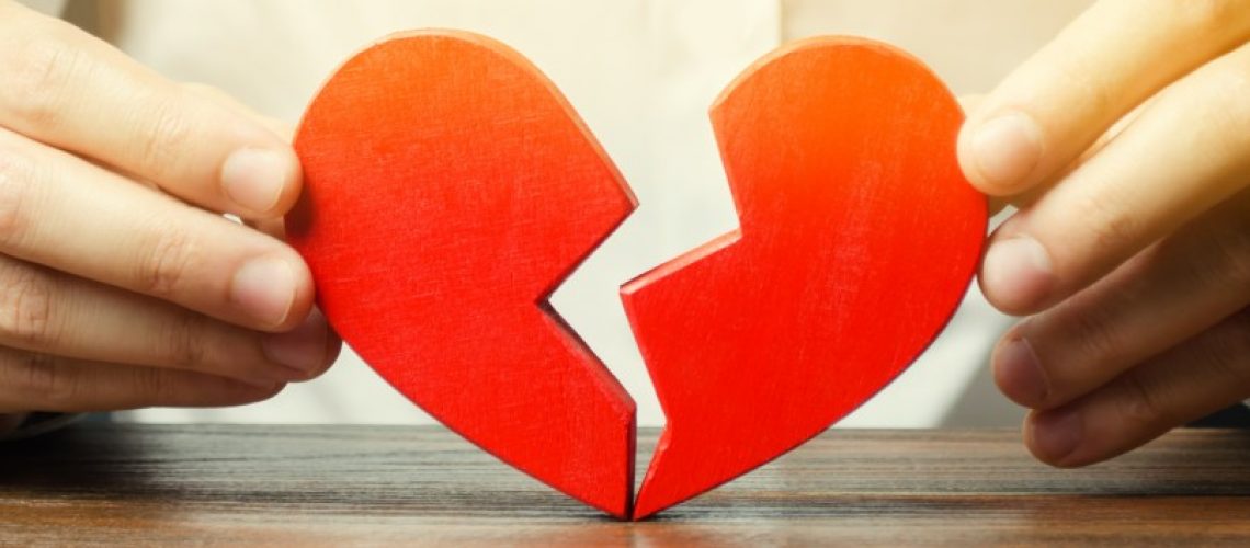 broken-heart-halves-collects-divorce-man-hands-alone-love-valentines-day-concept-sad-red-holding_t20_1Q2aPv