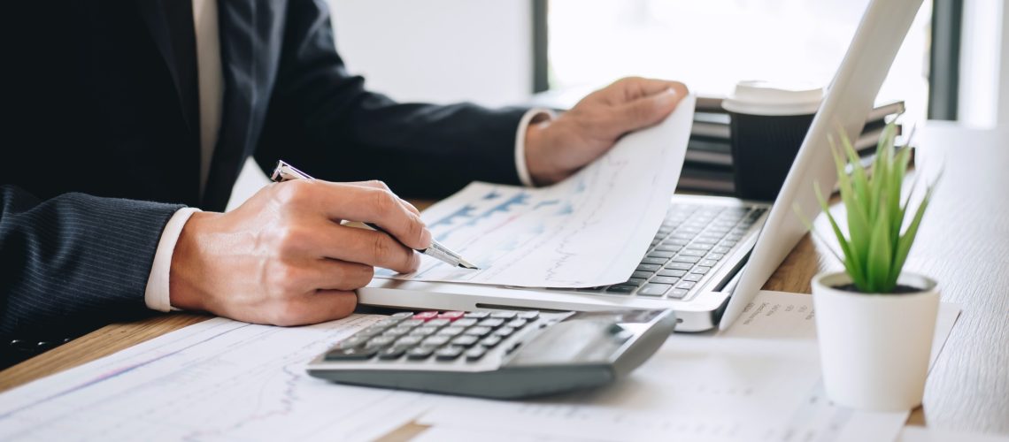 businessman-accountant-working-new-project-on-laptop-computer-with-report-document-and-analyze_t20_E4P9N7