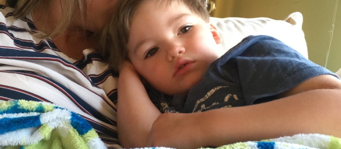 mom-comforting-sick-child_t20_e82av7